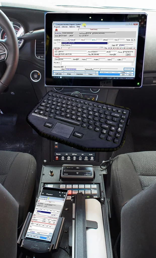 Public-safety vehicle workstation with monitor, keyboard, and docked smartphone