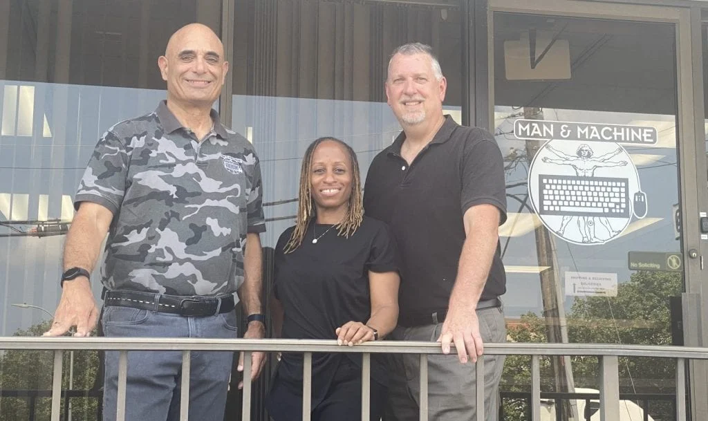 Clifton Broumand, Natasha Vandross, and Lenny Merryman outside the Man & Machine office