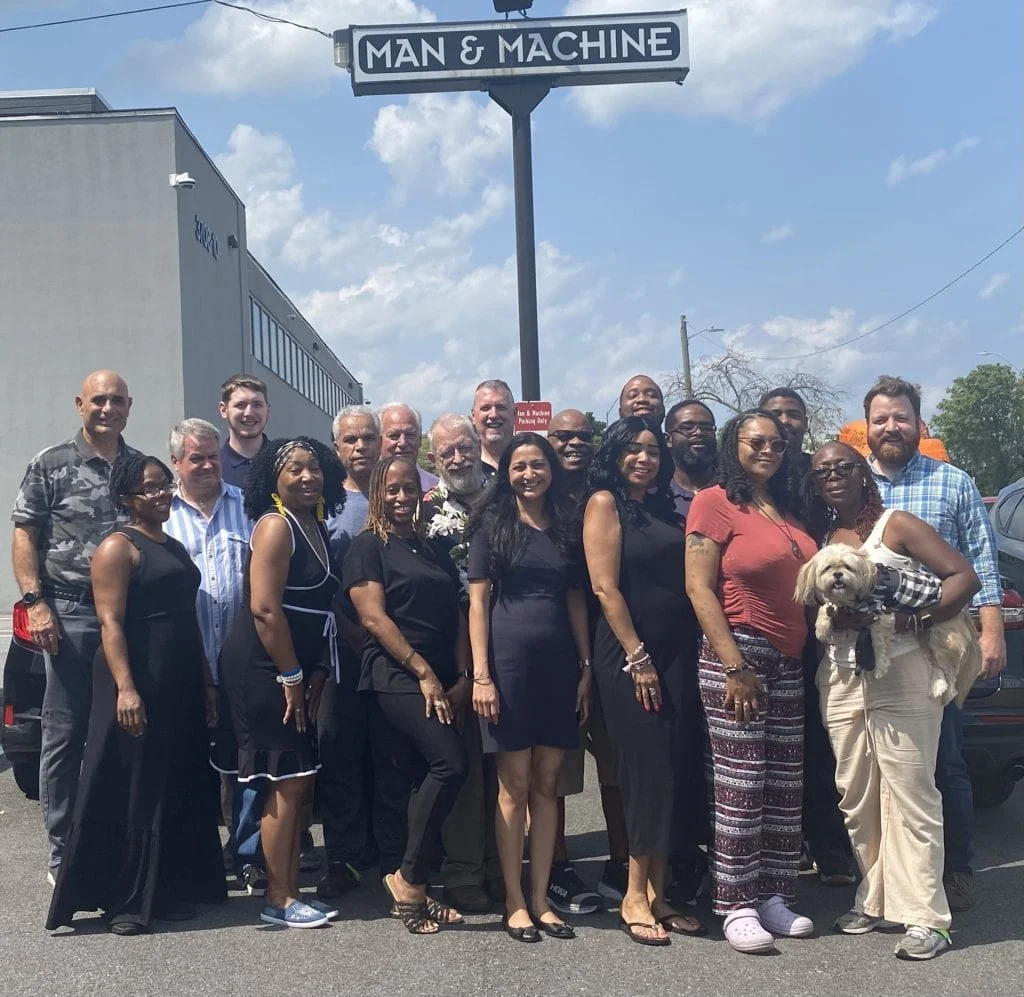Man & Machine team gathered outside the Landover office